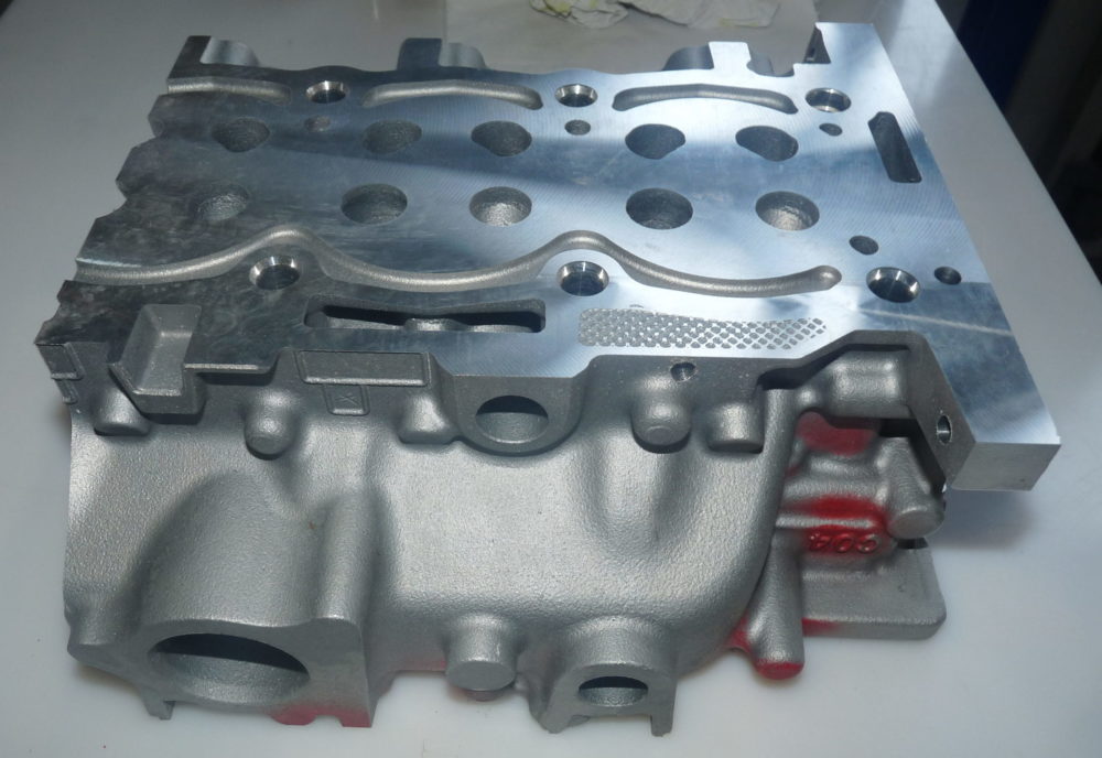 Car engine cylinder head cleaned with supercritical CO2 from Dense Fluid Degreasing  